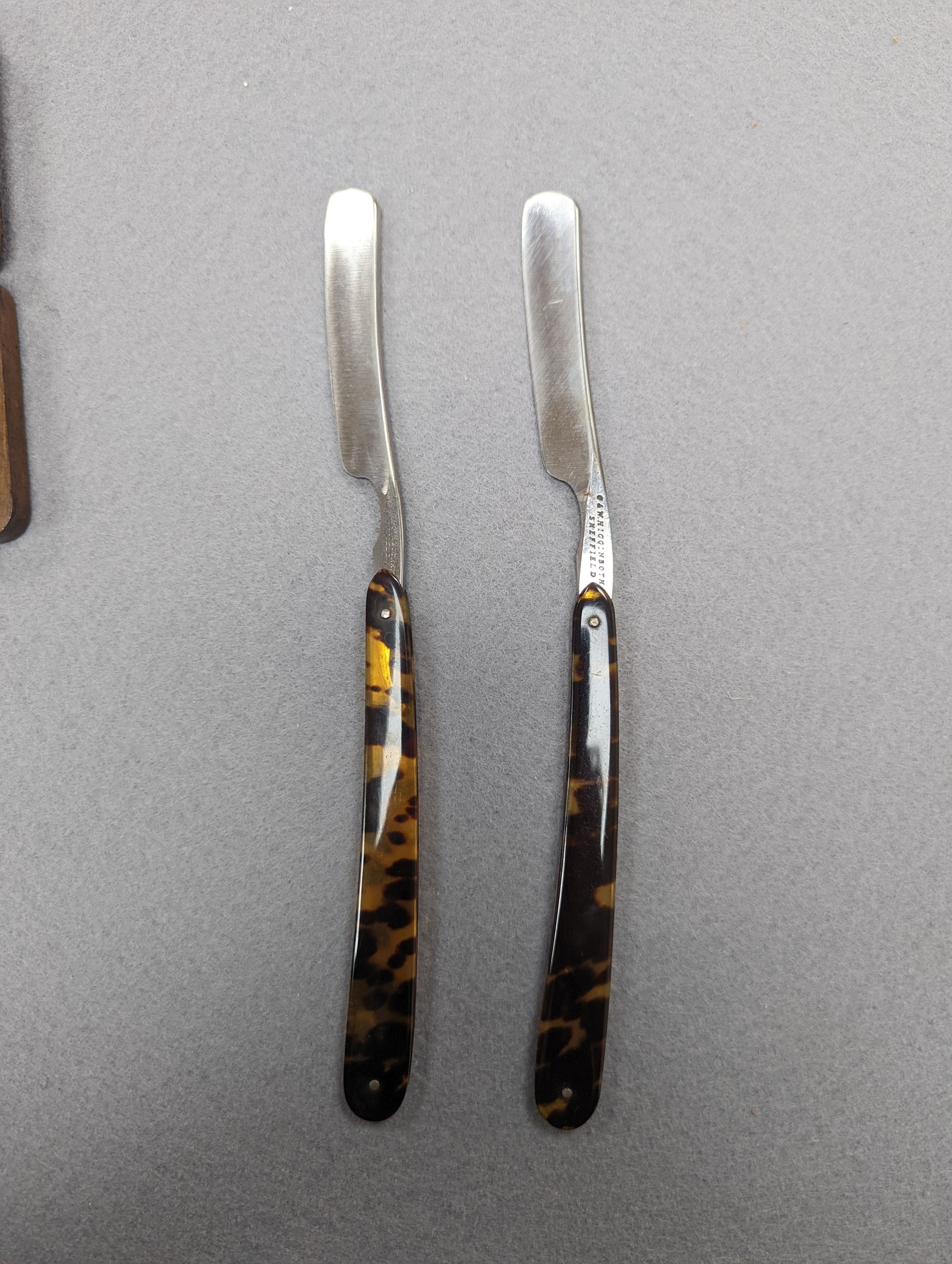 A set of seven tortoiseshell handled cut throat razors for the days of the week Wilkinson and a cased pair of tortoiseshell handled razors, C&W Higginbottom